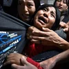 Pressefoto 2026: Famill, déi vun US-Immigratiounsautoritéit ICE festgeholl gëtt | © EPA/Carol Guzy, ZUMA Press, iWitness, for Miami Herald 