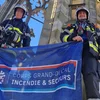 A voller Pompjeesmontur d'Trape vun der Ulmer Münster erop  | © Claude Kaufmann, Useldenger CGDIS